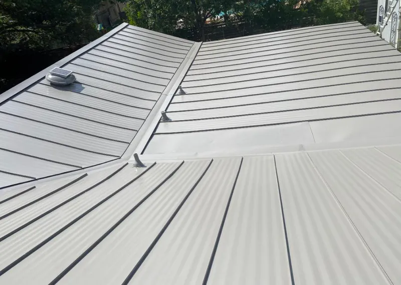 Solar attic fan installed on a metal roof for Roof Ventilation in Shoreview